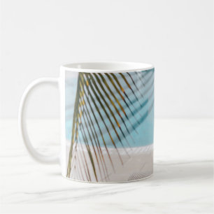Brown and black armchair beside swimming pool in t coffee mug