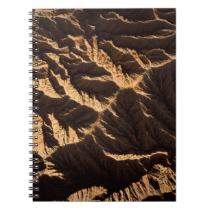 Brown and black sand in the morning notebook