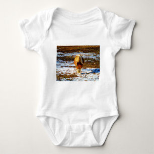 Brown and cream miniature horse in the snow. baby bodysuit