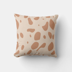 Brown and cream spotted pillow