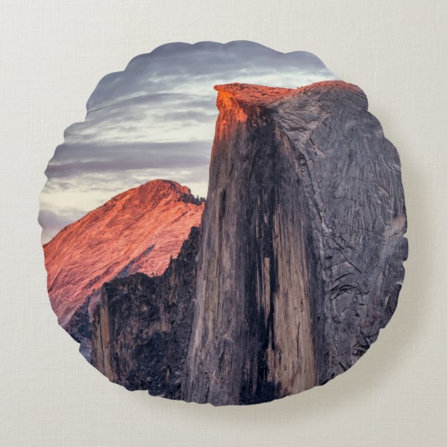 BROWN AND GRAY ROCK FORMATION UNDER GRAY CLOUDS ROUND CUSHION (Front)