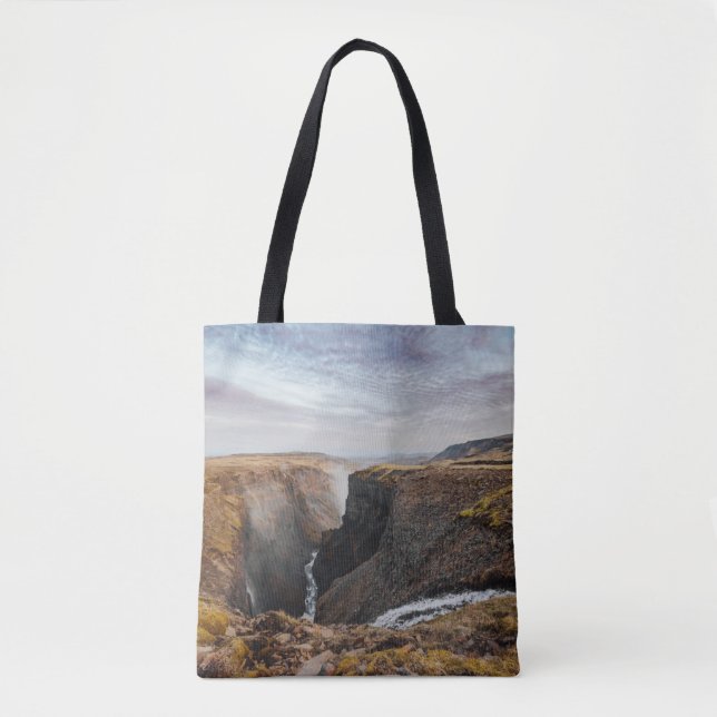 BROWN AND GRAY ROCKY MOUNTAIN UNDER GRAY CLOUDS TOTE BAG (Front)