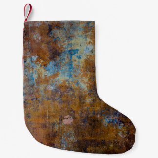 Brown and pink wooden surface small christmas stocking