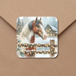 Brown and White Horse Country Christmas   Square Sticker<br><div class="desc">Pretty festive personalised Christmas stickers. A pretty brown and white horse standing behind an old rustic wood fence with a snowy background and vintage old red barn. The snow-filled fence is adorned with illuminated Christmas lights to give a warm festive feel to your country Christmas stickers sealers for your Christmas...</div>