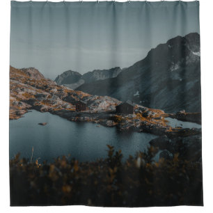 BROWN AND WHITE MOUNTAINS NEAR BODY OF WATER DURIN SHOWER CURTAIN