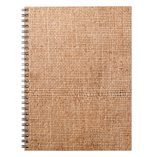 Brown burlap laying on white sheet. Abstract backg Notebook (Front)