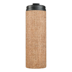 Brown burlap laying on white sheet. Abstract backg Thermal Tumbler