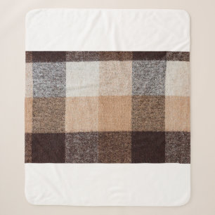 Brown chequered wool plaid fabric texture. tartan sherpa blanket