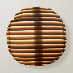 Brown closed window blinds round cushion