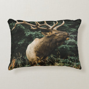 BROWN DEER ON GREEN GRASS DURING DAYTIME DECORATIVE CUSHION