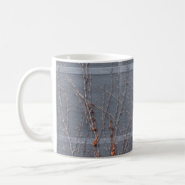 Brown dried leaves on water coffee mug (Left)