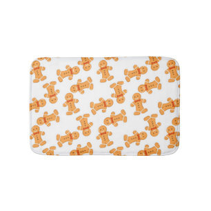 Brown gingerbread man on white bath mat