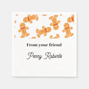 Brown gingerbread man on white napkin