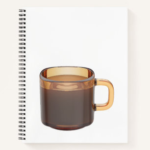 Brown glass coffee cup with brewed coffee notebook