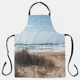 BROWN GRASS NEAR SEA UNDER BLUE SKY APRON