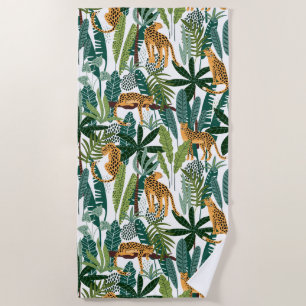 Brown leopard in tropical lush jungle leaves beach towel