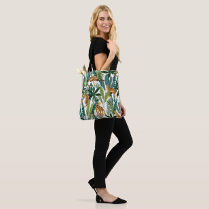 Brown leopard in tropical lush jungle leaves  tote bag