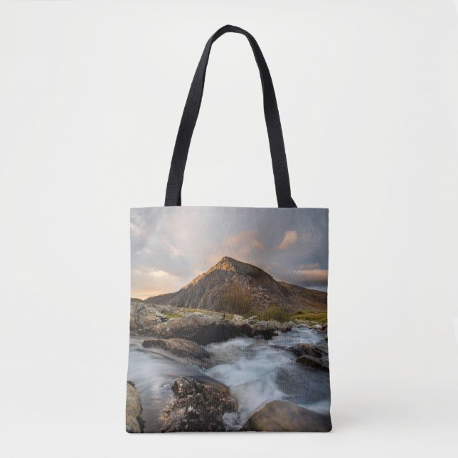 BROWN MOUNTAIN NEAR BODY OF WATER UNDER CLOUDY SKY TOTE BAG (Front)