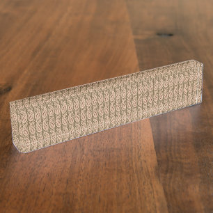 Brown rug featuring a detailed motif pattern with nameplate