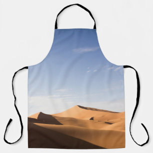BROWN SAND UNDER BLUE SKY DURING DAYTIME APRON