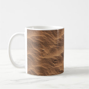 Brown sand with water during daytime coffee mug