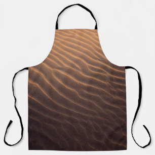 Brown sand with water in the morning apron