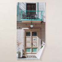 Brown wooden door on white concrete building