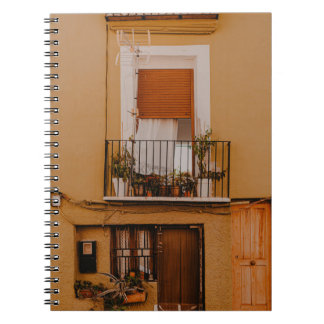 BROWN WOODEN WINDOW FRAME WITH GREEN PLANTS NOTEBOOK