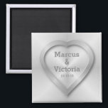 Brushed stainless steel wedding magnet<br><div class="desc">A wedding design for a modern wedding. This design has the look of brushed, polished steel or aluminium. There is a heart embossed on the design to look like pressed metal. The bride and grooms names can be edited to suit your needs. If you would like any help customising this...</div>
