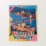 Budapest Hungary Night Cityscape Pop Art Collage Jigsaw Puzzle<br><div class="desc">Budapest Hungary night cityscape showcasing the historic Parliament building and Chain Bridge glowing along the Danube River. This illuminated skyline is reimagined as a pop art collage, blending classic vintage retro travel vibes with mixed media textures to celebrate Eastern Europe travel. Often called the 'Pearl of the Danube, ' this...</div>