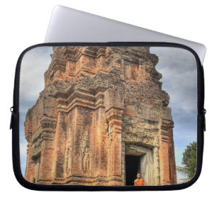 Buddhist monk standing in doorway of temple laptop sleeve