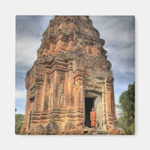 Buddhist monk standing in doorway of temple magnet