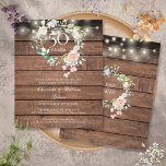 Budget Rustic Floral 50th Anniversary Invitation<br><div class="desc">Featuring a delicate watercolor floral roses garland and pretty string lights on a wood panels background, this chic rustic 50th wedding anniversary invitation can be personalised with your special anniversary information. The reverse features a matching floral garland framing your anniversary dates in elegant text on a wood panels background. Designed...</div>