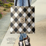 Buffalo Check Plaid Brown Black Monogram Name Tote Bag<br><div class="desc">Black, brown and white buffalo check plaid tote bag personalised with a monogram and optional name shown in a modern, chic handwritten script. The back side is a solid black colour that can be changed as desired. The text font style, size and colour can also be changed for a different...</div>