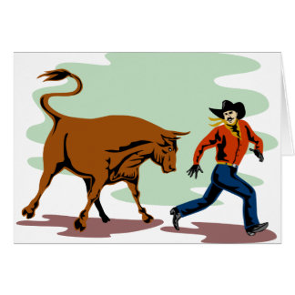 bull chasing rodeo cowboy