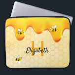 Bumble bees golden honeycomb honey dripping laptop sleeve<br><div class="desc">Yellow,  white background with a bee honeycomb pattern and happy smiling bumble bees. Decorated with sweet,  golden honey dripping. Templates for your name and monogram letter,  golden and black letters.  The name is written with a hand lettered style script.</div>