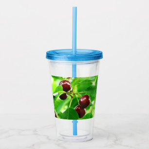 Bunches of cherries on a background of greens acrylic tumbler