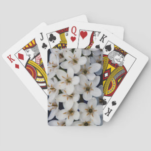 Bunches of white flowers playing cards