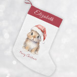 Bunny in Red Santa's Hat Personalised<br><div class="desc">Personalised Christmas Santa Bunny Stocking, perfect for your little ones this holiday season. This adorable stocking features a cute little bunny wearing a red Santa's hat covered with snow. Stocking can be personalised with your child's name. Hang it on your mantel or in your child's bedroom to add a festive...</div>
