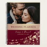 Burgundy Floral Photo Wedding Planner<br><div class="desc">Plan your dream day in style with this elegant wedding planner,  featuring a rich burgundy background,  golden floral accents,  string lights,  and a custom photo of the couple. A romantic and practical keepsake to guide your journey from engagement to “I do.”</div>