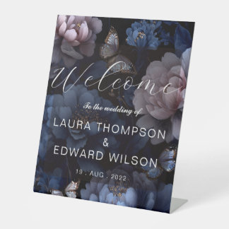 burgundy floral wedding design featuring rich wine pedestal sign