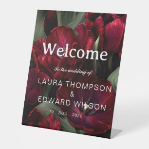 burgundy floral wedding design featuring rich wine pedestal sign