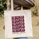 Burgundy Fun Retro Boho Personalised Bachelorette Tote Bag<br><div class="desc">Looking for the perfect personalised bridesmaid tote bags for your upcoming bachelorette party? Look no further than this burgundy fun retro boho personalised bachelorette tote bag! This tote bag is perfect for carrying all of your necessities on your big day. Plus, it's the perfect gift for your bridesmaids - who...</div>