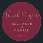 Burgundy Gold Heart Script Thank You Wedding Favou Classic Round Sticker<br><div class="desc">Elegant burgundy and gold heart script thank you sticker personalised with your names and special date. Designed by Thisisnotme©</div>