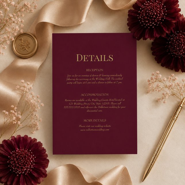Burgundy Gold Monogram Wedding Details Card (Burgundy Gold Monogram Wedding Details Card on ana elegant table with wedding decor & flowers)