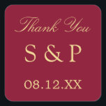 Burgundy Golden Beige Wedding Favour Thank You Square Sticker<br><div class="desc">Burgundy Golden Beige Wedding Favour Thank You Square Sticker,  please personalise with initials of the couple and the date of the wedding,  using the online personalisation template before ordering. The sticker features stylish text in a golden shade of beige (faux gold / gold look) on a classic burgundy background.</div>
