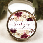 Burgundy Ivory Floral Wedding Thank You Classic Round Sticker<br><div class="desc">This elegant rustic wedding sticker features a lush burgundy and ivory watercolor floral design. The words "thank you" appear in burgundy handwriting calligraphy with swashes at the beginning and end. Add the couple's names and wedding date below.</div>