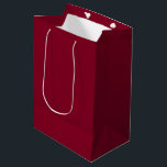 Burgundy Medium Gift Bag<br><div class="desc">Burgundy is a deep, rich color that blends dark red with undertones of purple and sometimes brown. It is often described as sophisticated, luxurious, and warm, similar to the color of red wine from the Burgundy region of France. Characteristics Hue: A purplish-red or reddish-purple that is darker and warmer than...</div>