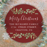 Burgundy Merry Christmas Greenery Return Address Classic Round Sticker<br><div class="desc">Watercolor greenery frames elegant script Merry Christmas typography on these elegant burgundy return address stickers. Personalise with your family name and address. Designed by Thisisnotme©</div>