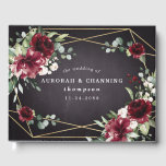 Burgundy Red Black and Gold Floral Elegant Wedding Guest Book<br><div class="desc">Design features a black chalkboard printed texture for the background with a printed gold coloured geometric frame that’s covered in unique elegant greenery that consists of eucalyptus and other leaves/branch elements. Design also features burgundy red rose and peony flowers and other blush pink floral elements for added unique décor.</div>